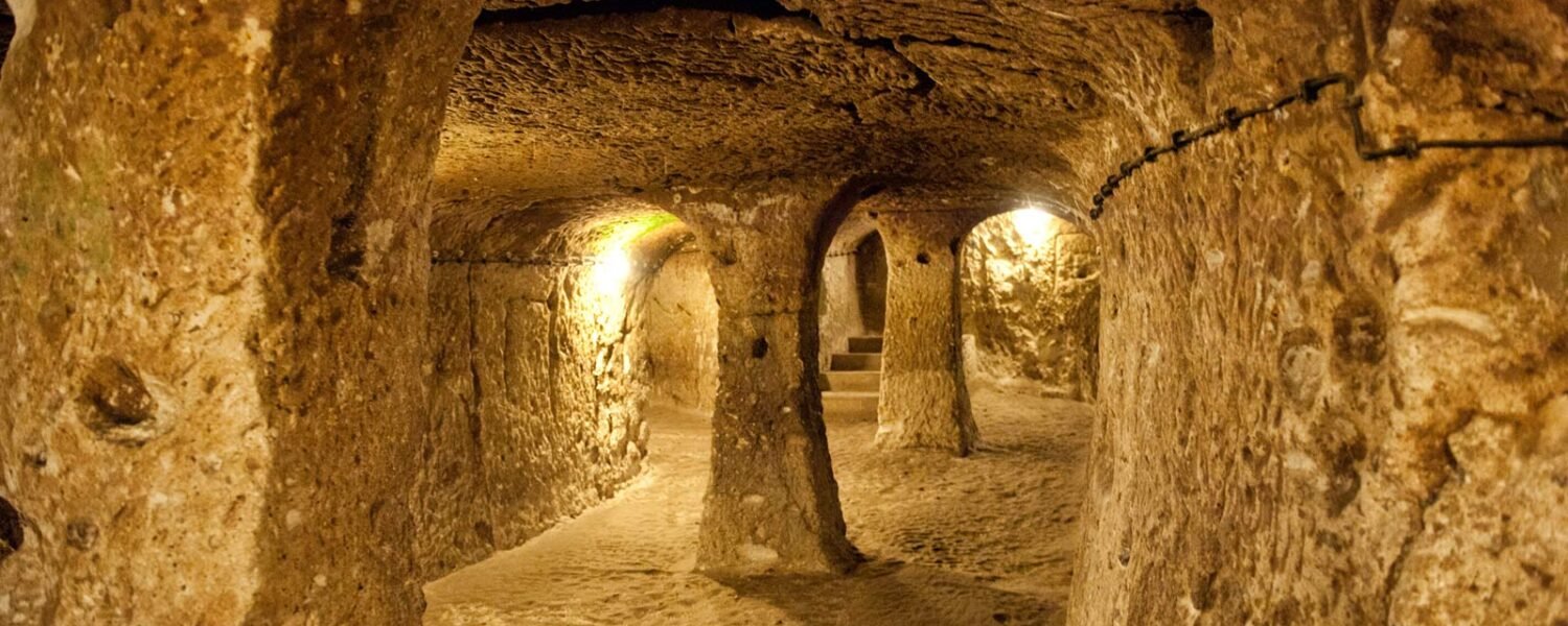 The narrow stone-walled corridors and niches of Derinkuyu Underground City.