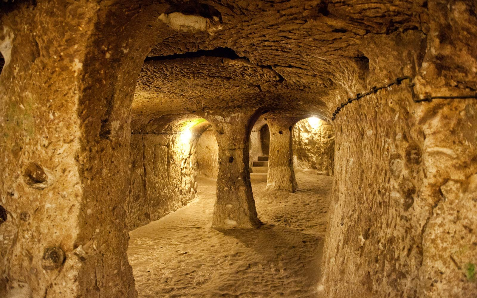 The narrow stone-walled corridors and niches of Derinkuyu Underground City.